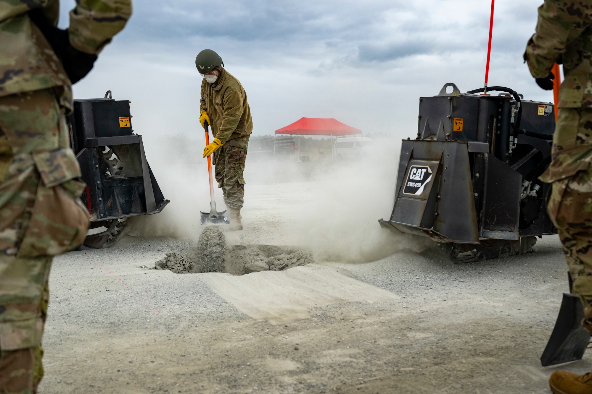 U.S. Airmen assigned to the 35th Civil Engineer Squadron, and Japanese Armed Forces muster for a safety brief prior to a bilateral rapid airfield damage repair exercise as part of Keen Sword 25 at Draughon Range near Misawa Air Base, Japan, Oct. 30, 2024.