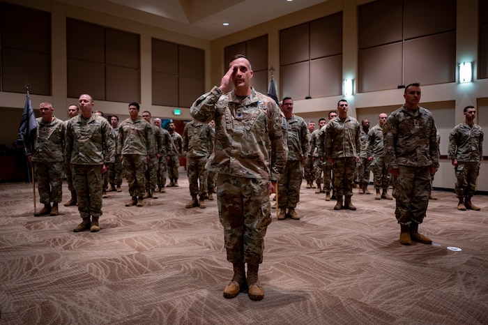 Servicemembers render a first salute to U.S. Space Force Col. Ernest “Bobby” Schmitt, Space Delta 4 commander, during the MD 4 redesignation ceremony, Oct. 30, 2024. Mission Deltas oversee all aspects of mission area functions – people, training, equipment and combat sustainment.
