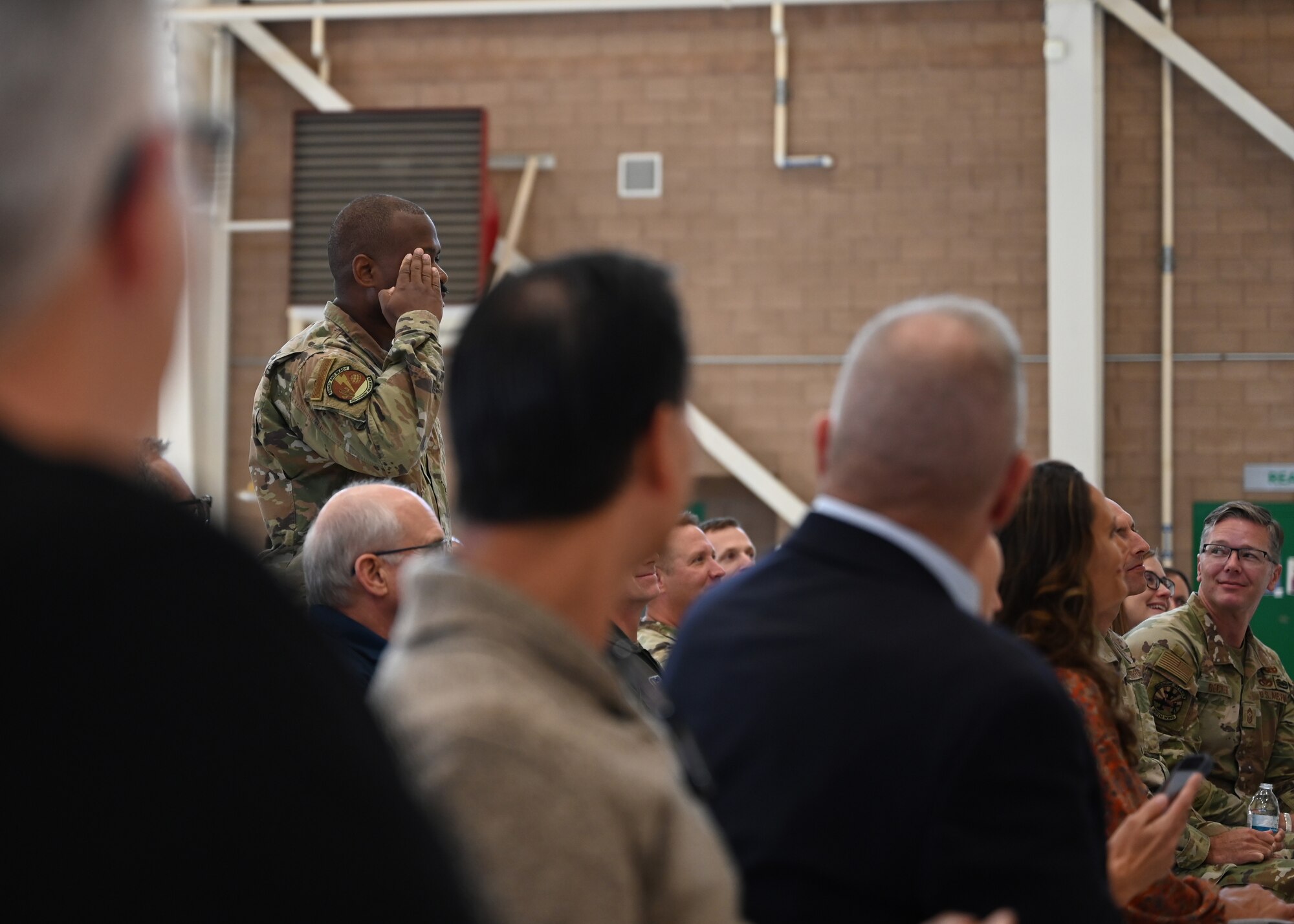 U.S. Air Force Chief Master Sgt. Jerome Clark, 11th Combat Air Base Squadron command chief, renders the first salute at the activation and assumption of command for the 11th Combat Air Base Squadron at Davis-Monthan Air Force Base, Arizona, Oct. 31, 2024. Airmen assigned to the 11th CABS will train, prepare and deploy together, delivering combat capabilities to the joint force. (U.S. Air Force photo by Staff Sgt. Abbey Rieves)