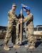 Lt. Col. Aaron Zamora, right, incoming commander of the Kentucky Air National Guard’s 123rd Contingency Response Group, accepts the group guidon from Col. Bruce Bancroft, 123rd Airlift Wing commander, during a change-of-command ceremony at Amedee Army Airfield, Calif., Aug. 26, 2024. The ceremony took place at the end of a week-long exercise that tested the 123rd CRG’s capability to conduct a Joint Task Force-Port Opening, an operation designed to safely and effectively distribute cargo and supplies to austere areas affected by catastrophic events or conflict. (U.S. Air National Guard photo by Master Sgt. Joshua Horton)