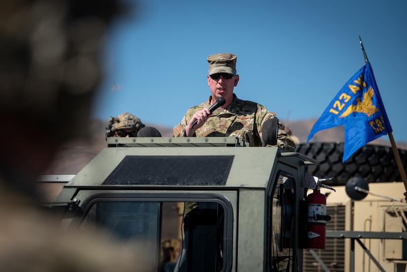 Col. Bruce Bancroft, commander of the Kentucky Air National Guard’s 123rd Airlift Wing, speaks during a change-of-command ceremony at Amedee Army Airfield, Calif., Aug. 26, 2024, in which Lt. Col. Aaron Zamora assumed command of the 123rd Contingency Response Group. The ceremony took place at the end of a week-long exercise that tested the 123rd CRG’s capability to conduct a Joint Task Force-Port Opening, an operation designed to safely and effectively distribute cargo and supplies to austere areas affected by catastrophic events or conflict. (U.S. Air National Guard photo by Master Sgt. Joshua Horton)