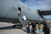 16 Greater San Antonio area civic leaders board a 433rd Airlift Wing C-5M Super galaxy after learning about the 926th Wing missions on a civic leader tour at Nellis Air Force Base, Nevada, Oct. 23, 2024.