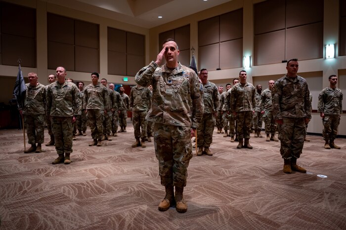 Servicemembers render a first salute to U.S. Space Force Col. Ernest “Bobby” Schmitt, Space Delta 4 commander, during the MD 4 redesignation ceremony, Oct. 30, 2024. Mission Deltas oversee all aspects of mission area functions – people, training, equipment and combat sustainment.
