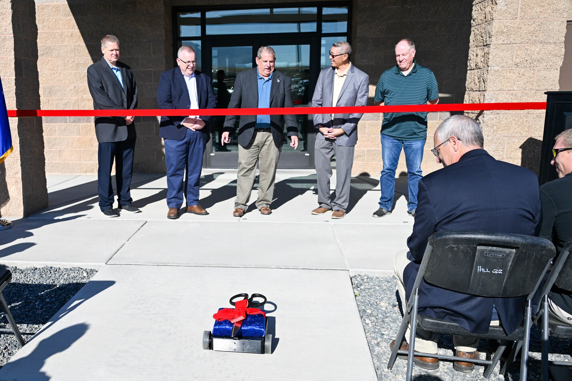 Ceremonial scissors are delivered via robot