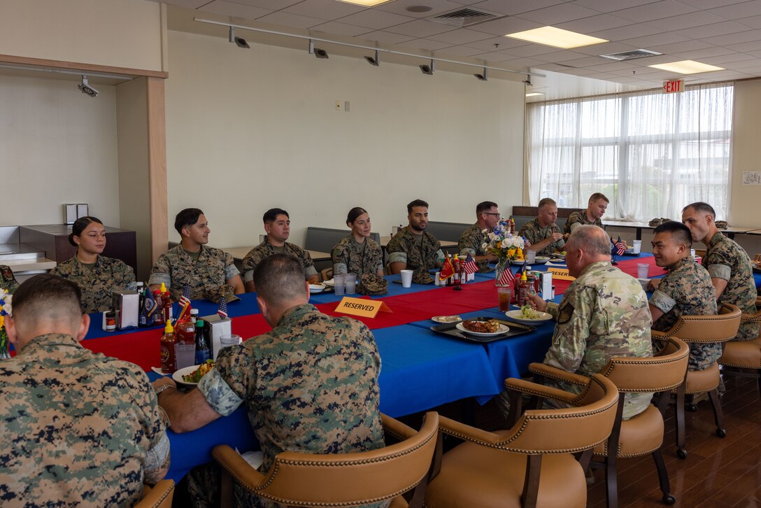 U.S. Air Force Lt. Gen. Ricky Rupp, the commander of United States Forces Japan and a Texas native, meets with Marines and Sailors from across Marine Corps Air Station Iwakuni to discuss the quality of life on MCAS Iwakuni during a tour of the installation at MCAS Iwakuni, Japan, Aug. 21, 2024. While touring MCAS Iwakuni, Lt. Gen. Rupp met with service members to understand what the daily operations and quality of life is like on the installation. (U.S. Marine Corps photo by Cpl. Isaac Orozco)