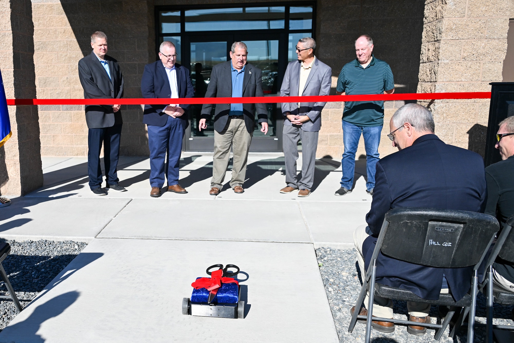 Ceremonial scissors are delivered via robot
