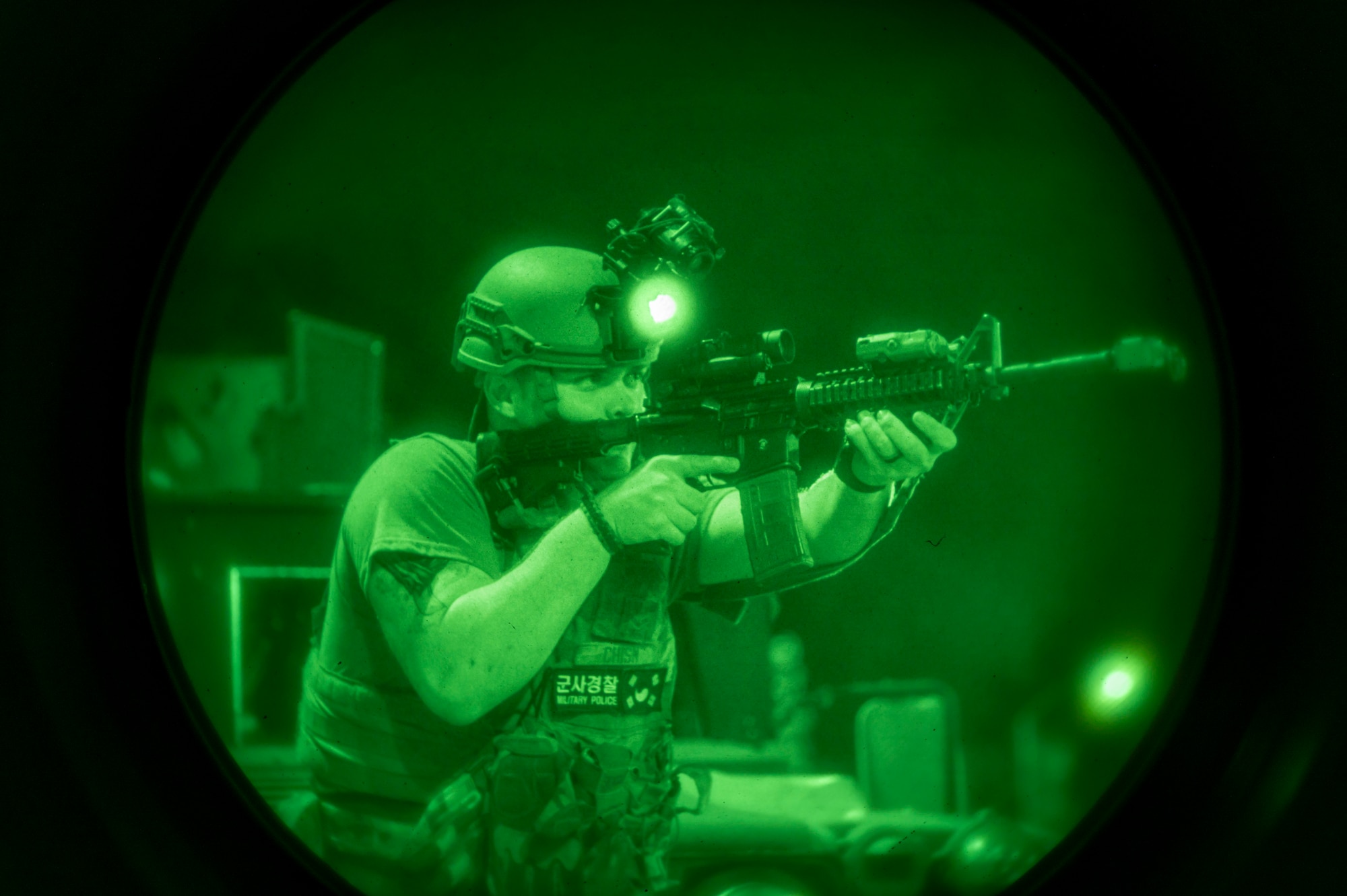 U.S. Air Force Airman 1st Class Tylor Chism, 51st Security Forces Squadron Airman, engages simulated opposing forces during Ulchi Freedom Shield 24, at Osan Air Base, Republic of Korea, Aug. 20, 2024. During UFS 24, Defenders and augmentees tested their ability to respond to opposing forces who infiltrated the base, demonstrating defensive tactics and combat readiness. UFS24 is an annual combined exercise conducted in support of the U.S.-ROK Mutual Defense Treaty that highlights the U.S. commitment to the alliance. (U.S. Air Force photo by Senior Airman Sabrina Fuller-Judd)