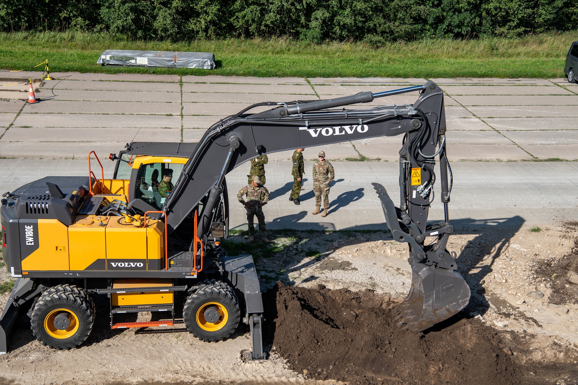 a machine digs a hole