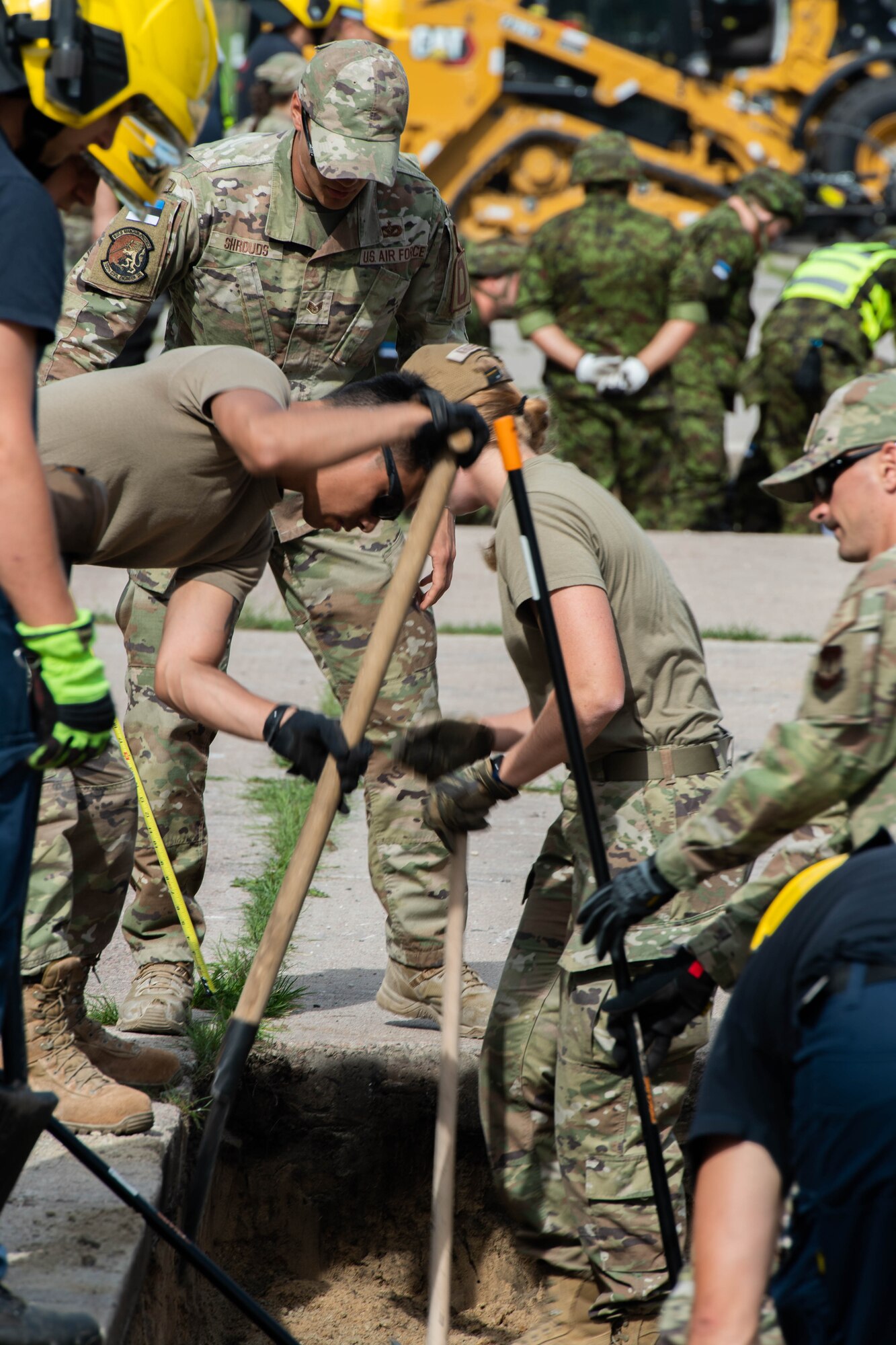 Airman spread dirt in hole