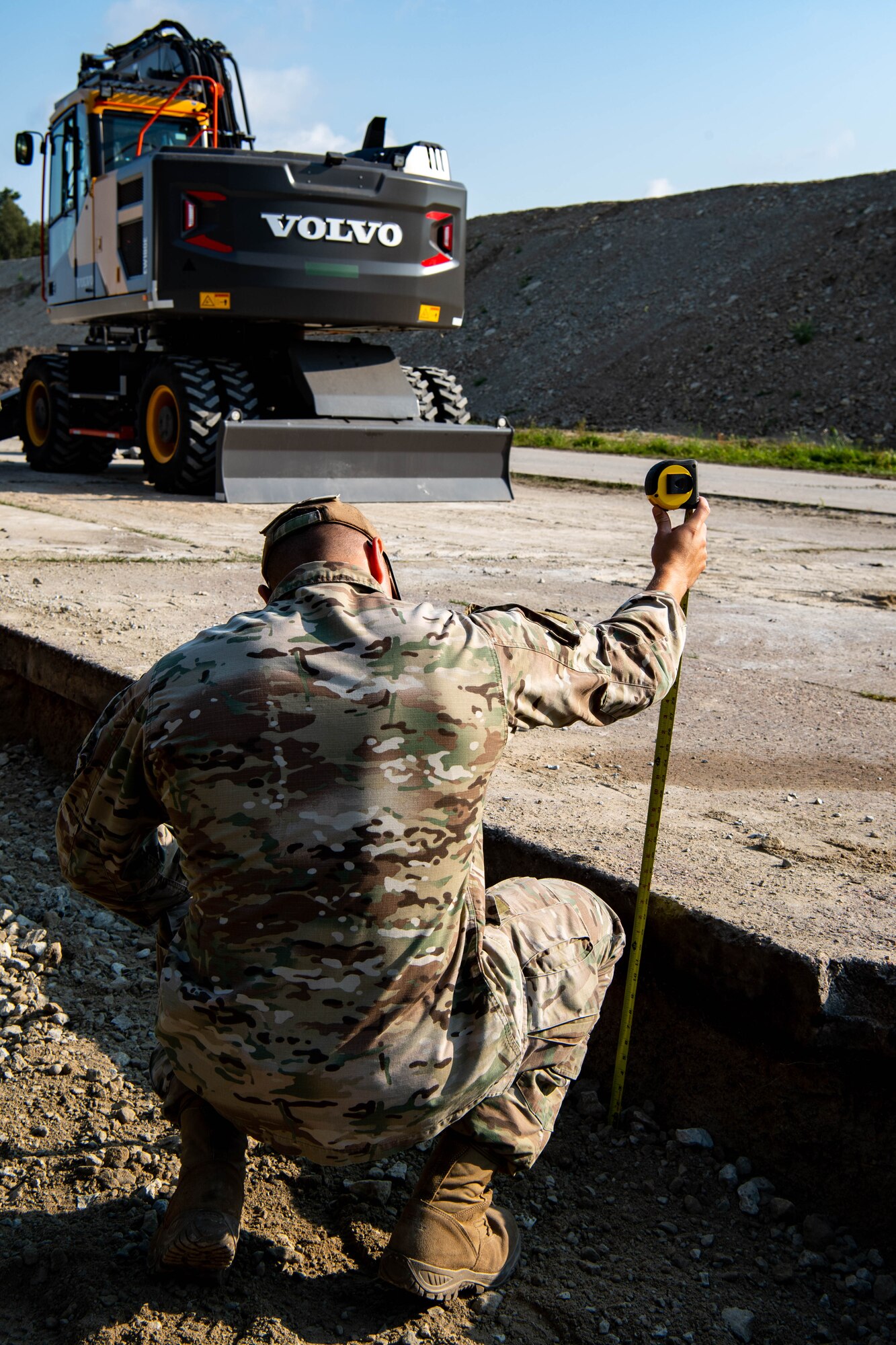Airman measures distance in hole