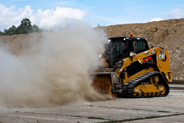 machine spreads dirt