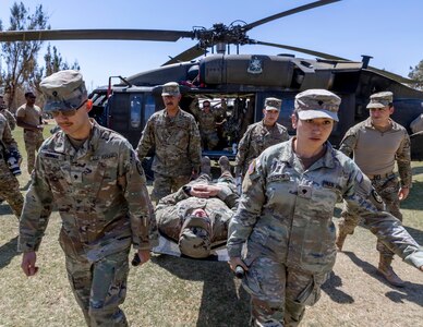 Texas Army National Guard and Chilean army soldiers carry a litter off a U.S. UH-60 Black Hawk helicopter while conducting medical evacuation training during Southern Fenix 24 at Campo Militar Pozo Almonte, Chile, Aug. 29, 2024.