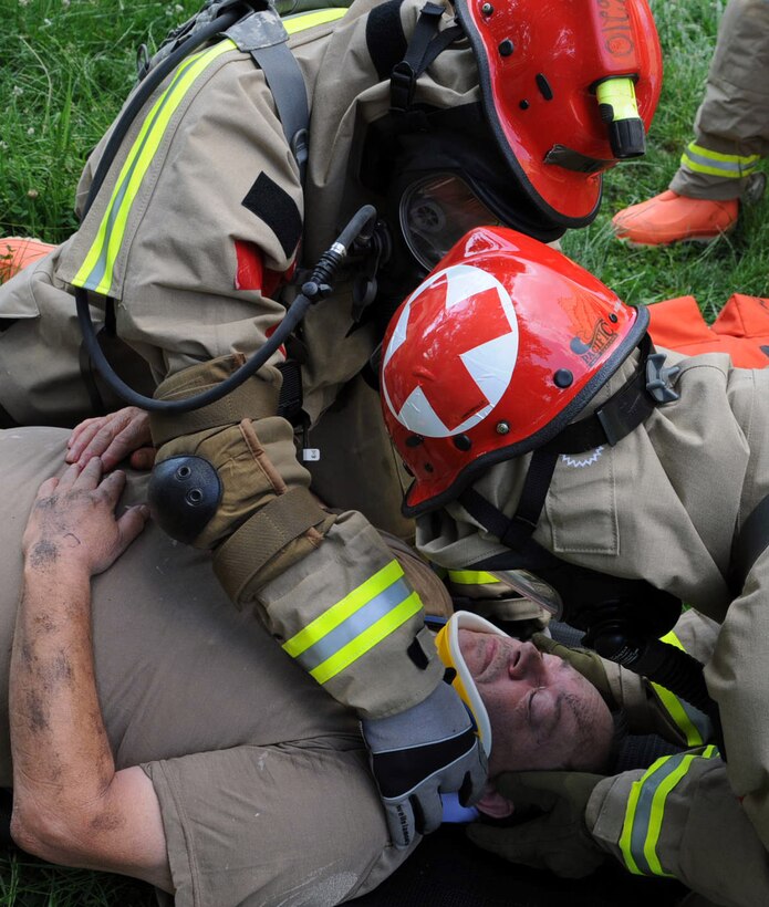 A mock casualty is stabilized by members of the Kentucky National Guard's Chemical Biological Radiological Nuclear high-yield Explosive Response Force Package's Search and Extraction team May 23, at the Muscatatuck Urban Training Center in Butlerville, Ind. The joint CERFP includes Army and Air guardsmen who can provide immediate response capabilities to the Commonwealth of Kentucky in the event of a CBRNE incident.