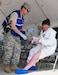 Lt. Col. Dan A. Manning, a physician assistant, assesses a mock casualty as part of the Kentucky National Guard Chemical Radiological Nuclear High-Yield Explosives Enhanced Response Force Package training May 23 at Muscatatack Urban Training Center, Butlerville, Ind.