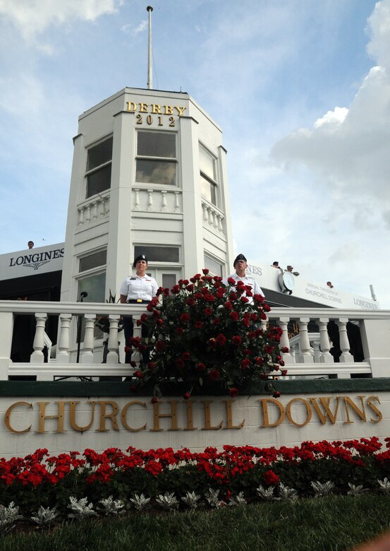 Kentucky Army Guardsmen Pfc. Kara Denise Bucklew and Spc. Eddy D. Mitchell, both military policemen with the 223rd Military Police Company stationed in Louisville, Ky., guard the winner's trophy in front of the winner's circle at Churchill Downs in Louisville, Ky., May 5 2012. This year marks the 138th running of the roses and was Bucklew's first derby experience.