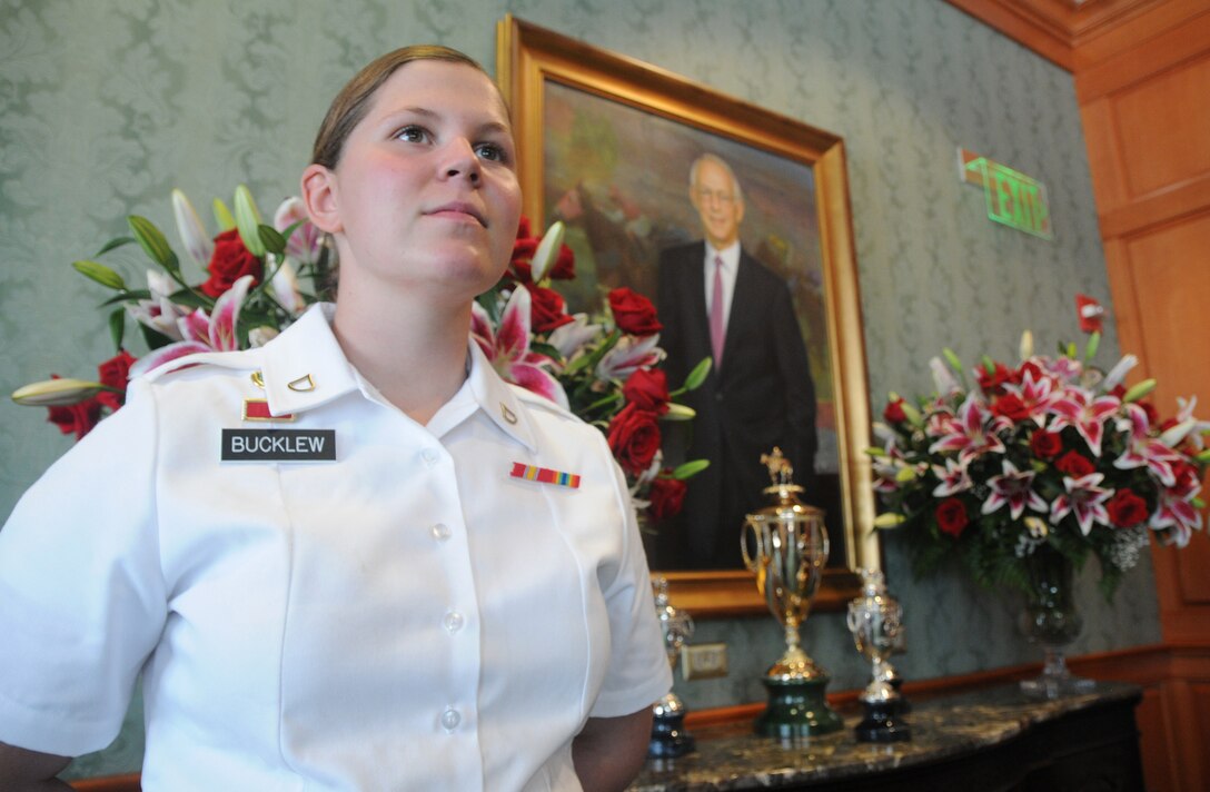 Kentucky Army Guardsman Pfc. Kara Denise Bucklew, a military policeman with the 223rd Military Police Company, guards the winner's trophy for the Kentucky Derby in the Director's Room on Millionaire Row at Churchill Downs in Louisville, Ky., May 5, 2012.