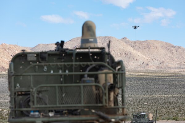 An unmanned vehicle navigates desert terrain.