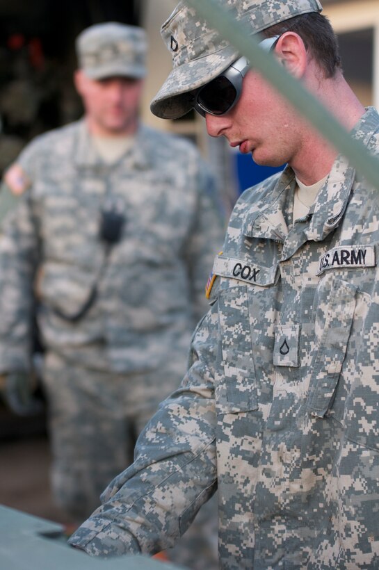 Kentucky National Guard Pfc. Lance S. Cox, a refueler assigned to the Maysville, Ky.-based 299th Chemical Company, fules a Humvee, March 6, in West Liberty, Ky., during tornado relief efforts. Elements from the 103rd Chemical Battalion responded hours after a tornado ravaged West Liberty March 2, and continued to provide law enforcement and humanitarian support in the week after the storm. Cox's mission was to refuel anything that needed diesel fuel to include generators at the local hospital and incident command trailers as well as military and power company trucks.