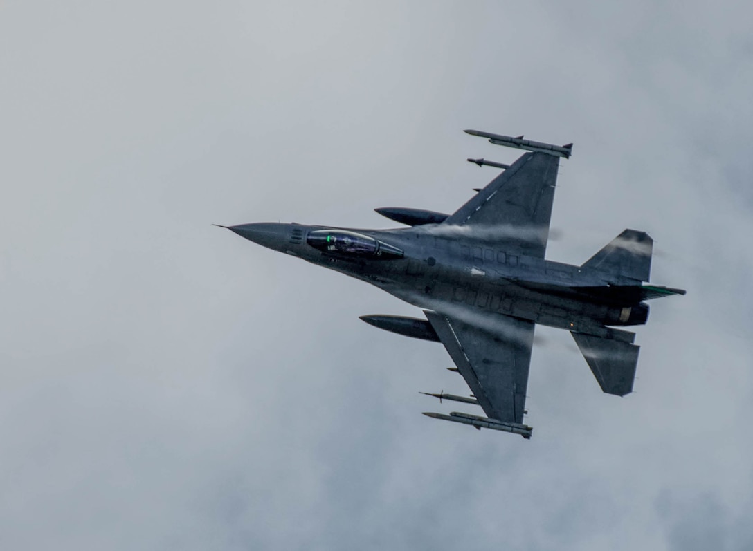 An F-16 Fighting Falcon assigned to the Ohio National Guard’s 180th Fighter Wing flies overhead Aug. 9 during Northern Lightning, an exercise providing realistic combat training for and emphasizing joint asset integration, held annually at Volk Field, Wis. Training between fourth and fifth generation aircraft is critical to ensure the Air Force is able to meet near-peer war fighting needs now and in the future. U.S. Air National Guard photo by Airman 1st Class Josh Kaeser