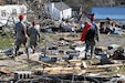 Kentucky National Guard service members engage in a search and rescue mission in West Liberty, Ky., for survivors after torrential storms and violent winds destroyed much of the community there, March 2.