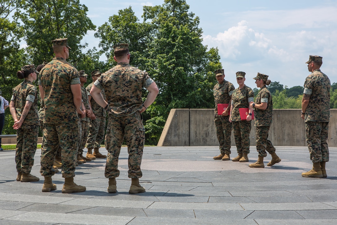 U.S. Marine Corps Sgt. Haley G. Gillrivera, a motor vehicle operator at The Basic School, left, and Cpl. Brandon Gillrivera, a motor vehicle operator at Officer Candidates School, pose for a portrait with their certificates of reenlistment after their reenlistment ceremony at the National Museum of the Marine Corps, Triangle, Virginia, Aug. 1, 2024. The Gillriveras are a dual-military couple who decided to reenlist together, continue to develop their individual careers, and utilize the benefits the Marine Corps has to offer to their family. (U.S. Marine Corps photo by Lance Cpl. Anthony Ramsey)