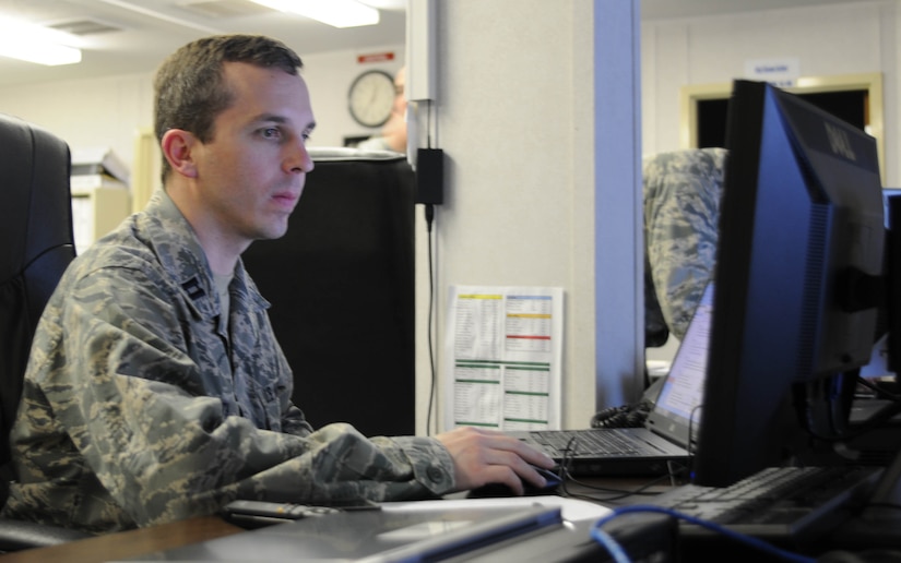 Kentucky Air National Guard Capt. John P. Roth produces intelligence products in support of operations, March 3.