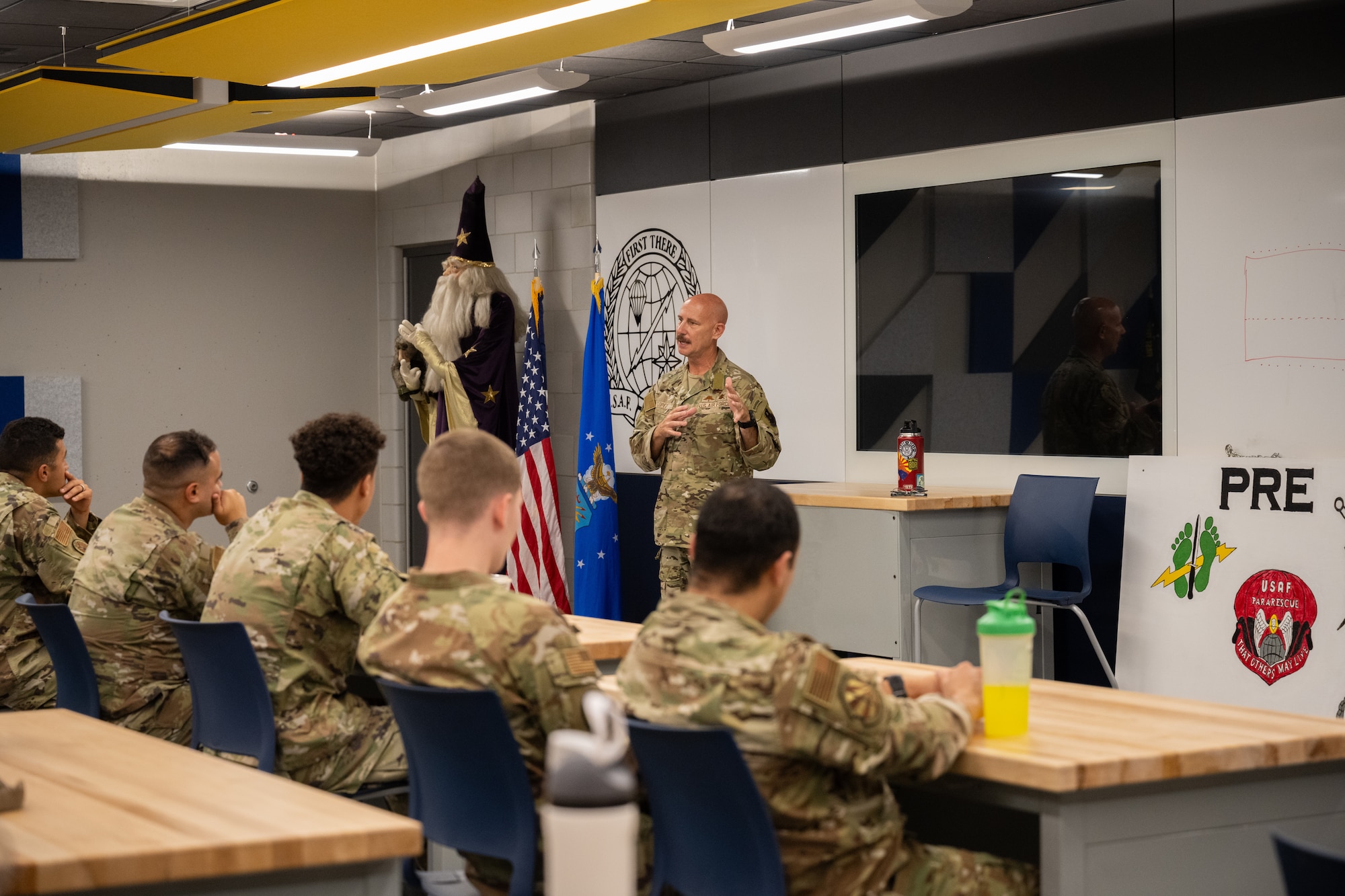 An Air Force Colonel speaks to a group of recruiters