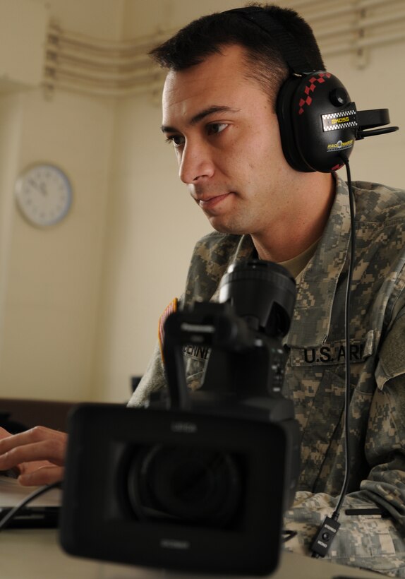 Spc. Josh Bennett, broadcast journalist with the 133rd Mobile Public Affairs Detachment, reviews the footage he shot during the Morale, Welfare and Recreation trips offered during Yama Sakura 61 in Osaka, Japan, Jan. 28.