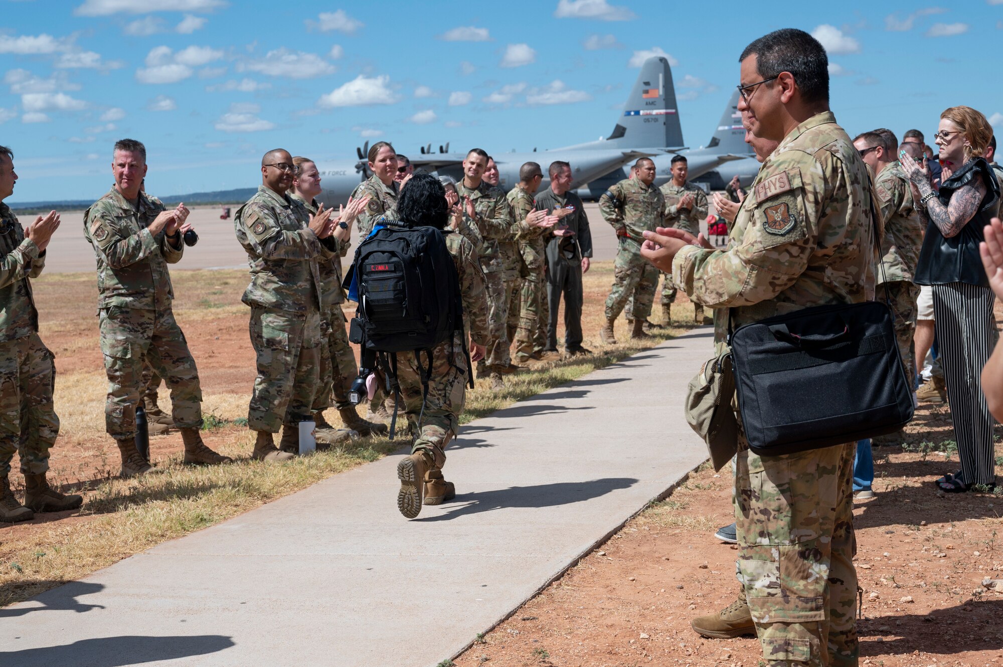 A 317th Airlift Wing Airman departs for deployment at Dyess Air Force Base, Texas, Aug. 27, 2024. The 317th AW Rapid Global Mobility mission requires readiness to respond to worldwide requirements, as required and tasked through the U.S. Central Command and Air Mobility Command. (U.S. Air Force photo by Airman 1st Class Emma Anderson)