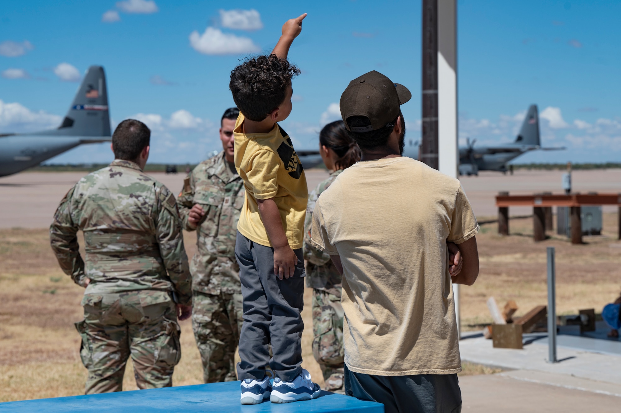 Family and friends of 317th Airlift Wing Airmen watch their loved ones depart for deployment at Dyess Air Force Base, Texas, Aug. 27, 2024. The 317th AW Rapid Global Mobility mission requires readiness to respond to worldwide requirements, as required and tasked through the U.S. Central Command and Air Mobility Command. (U.S. Air Force photo by Airman 1st Class Emma Anderson)