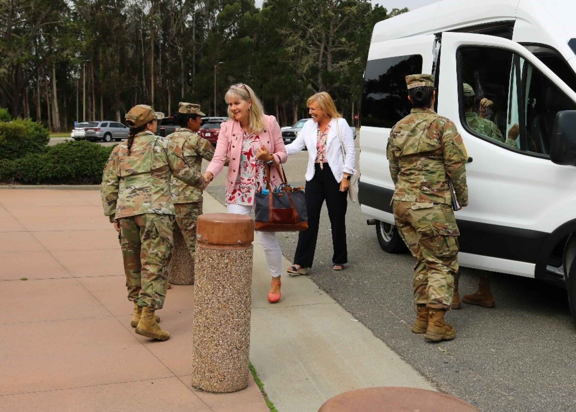 Key spouses of Space Systems Command meet members of the 30th Force Support Squadron during a tour of the Outdoor Recreation Center at Vandenberg Space Force Base.
