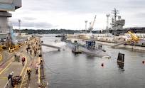 A team of Code 740, Riggers, helps guide USS Jimmy Carter (SSN 23) into Dry Dock 6, Aug. 21, 2024, in preparation for the submarines Fiscal Year 24 Docking Continuous Maintenance Availability at Puget Sound Naval Shipyard & Intermediate Maintenance Facility in Bremerton, Washington. (U.S. Navy photo by Wendy Hallmark)