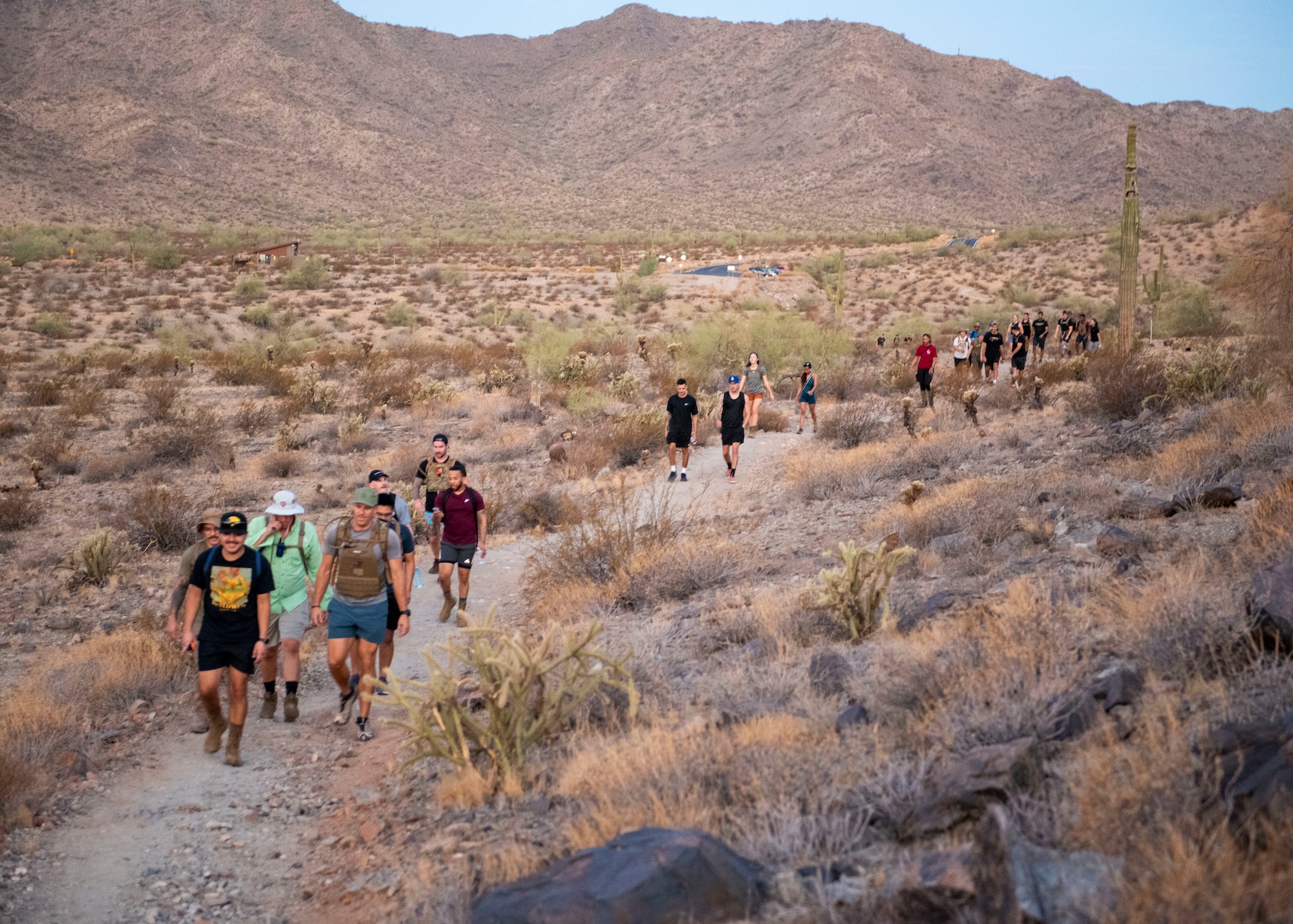 John J. Rhodes Airman Leadership School Class 24-6 set off on an early hike, Aug. 21, 2024, at Skyline Regional Park, Buckeye, Arizona.