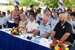 Left to right, Ms. Anjanette Knappenberger, executive director and director of staff for Commander, U.S. Pacific Fleet, U.S. Navy Capt. Daniel Keeler, Pacific Partnership 2024-2 (PP24-2) mission commander, Royal Australian Air Force Wing Cmdr. Scott Minchin, PP24-2 deputy mission commander and civilian mariner Capt. Christopher Jackson, ship’s master of the expeditionary fast transport ship USNS City of Bismarck (T-EPF 9), watch a dance performance at the closing ceremony for PP24-2 and PA24-3 at Tinh Khe Elementary School in Quang Ngai, Vietnam Aug. 30, 2024.