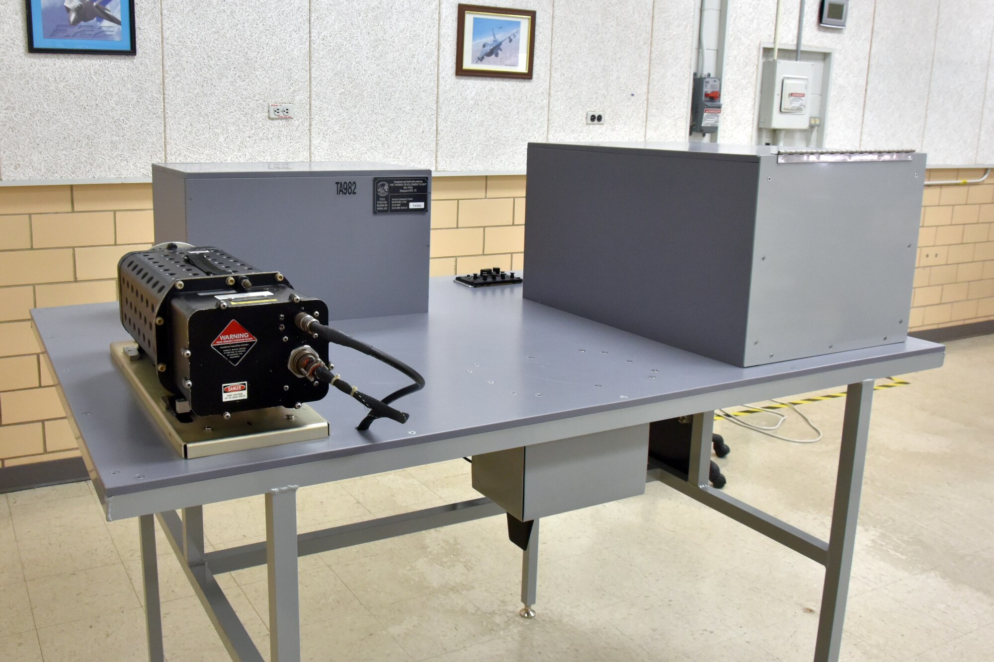 A gray metal table in a classroom.