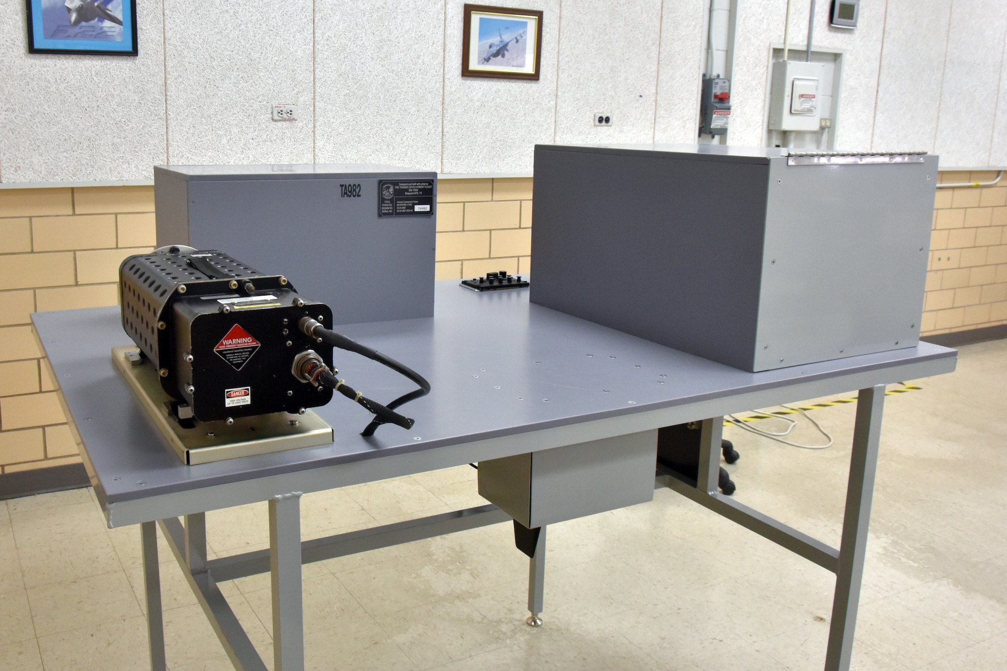 A gray metal table in a classroom.