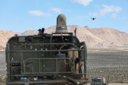 An unmanned vehicle navigates desert terrain.