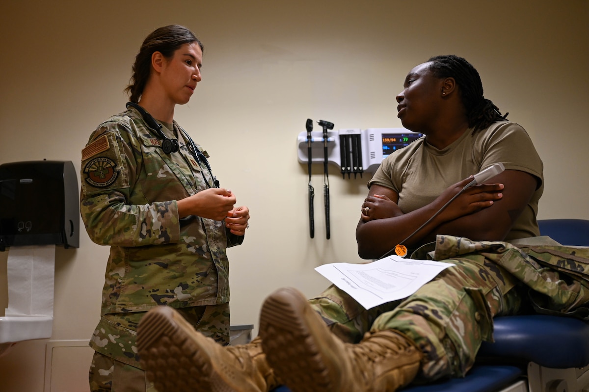 U.S. Air Force Capt. Chandler Nann, 355th Medical Group physician addresses a simulated anthrax patient about her symptoms at Davis-Monthan Air Force Base, Arizona, Aug. 21, 2024. Exercises provide each unit an opportunity to practice scenarios and mitigate risks for future operations. (U.S. Air Force photo by Senior Airman Andrew Garavito)