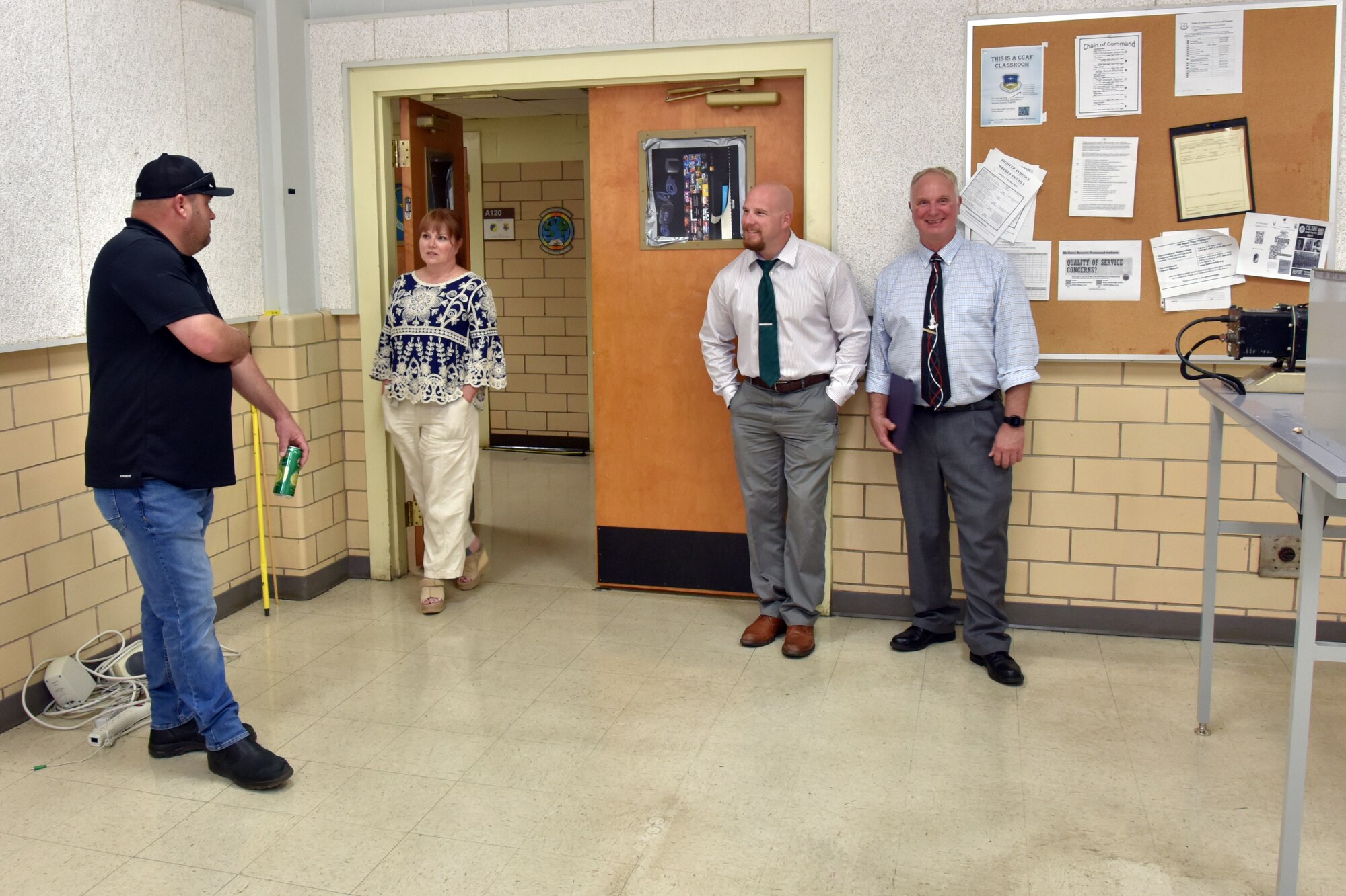People stand in a classroom