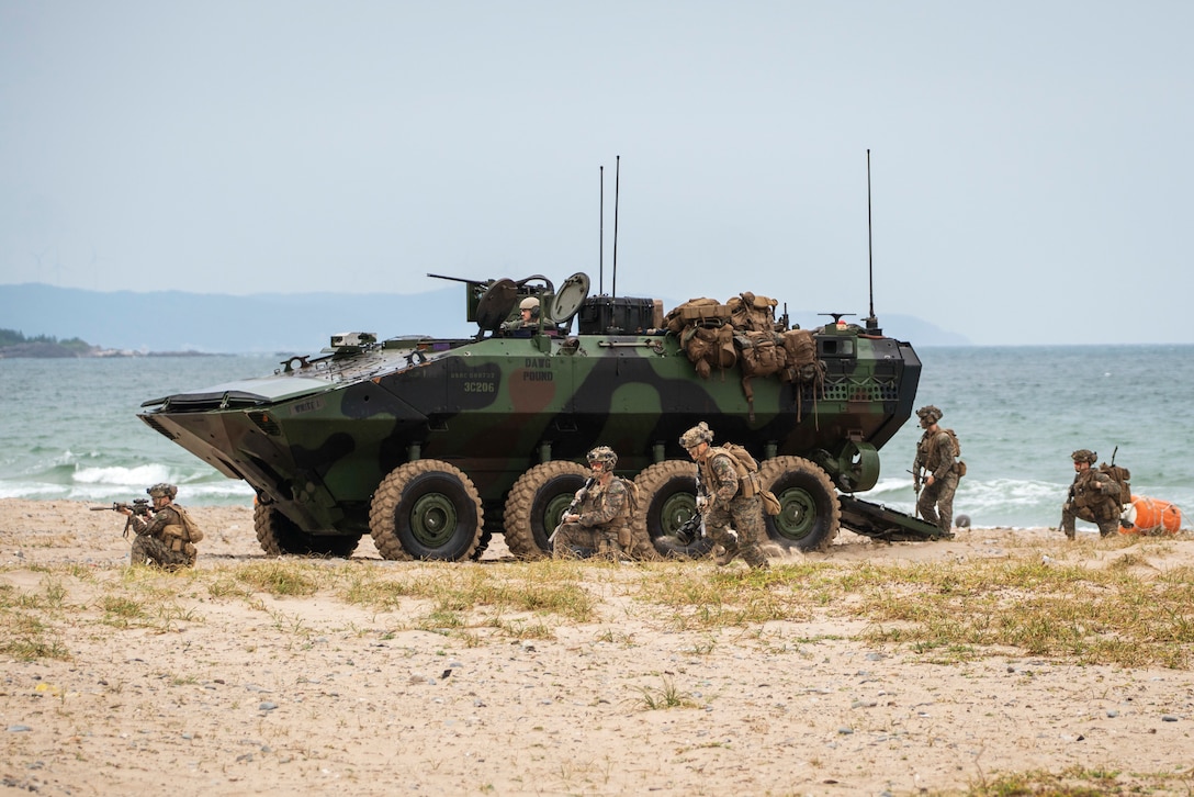 U.S. Marines assigned to Alpha Company, Battalion Landing Team 1/5, 15th Marine Expeditionary Unit, egress an Amphibious Combat Vehicle to secure the beach at Hwajin-ri, South Korea, Sept. 2, 2024, during a simulated amphibious assault as part of exercise Ssang Yong 24.