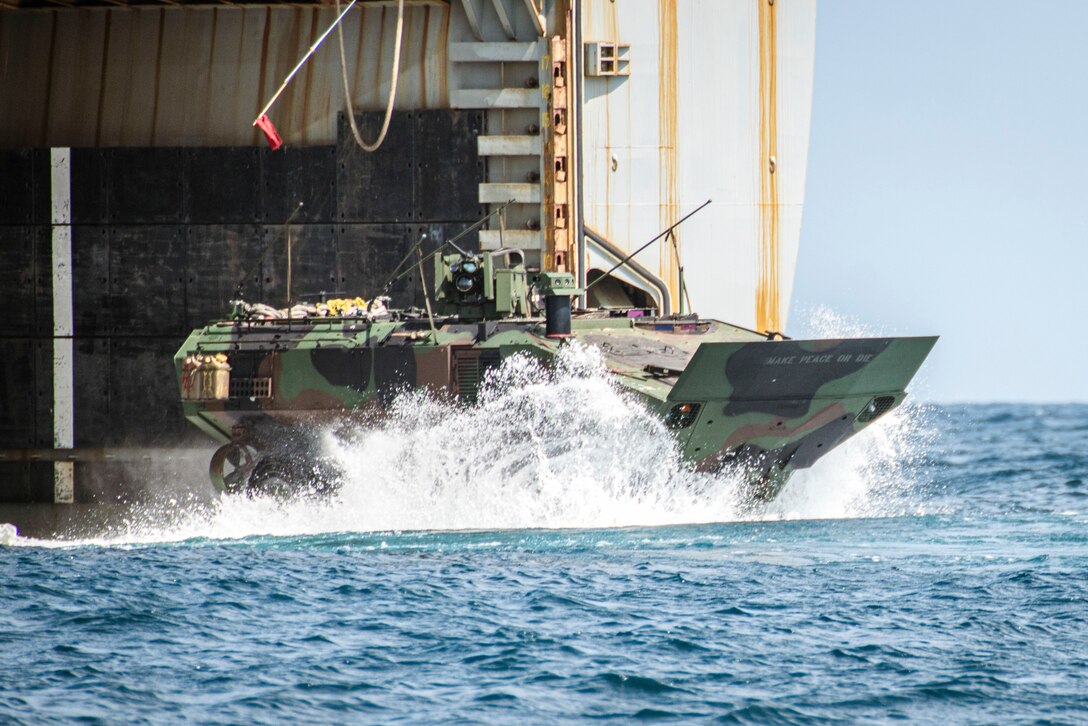 A U.S. Marine Corps Amphibious Combat Vehicle attached to Alpha Company, Battalion Landing Team 1/5, 15th Marine Expeditionary Unit, enters the water from the amphibious dock landing ship USS Harpers Ferry (LSD 49) in waters east of South Korea, Sept. 1, 2024, during exercise Ssang Yong 24. Exercise SY 24 strengthens the Republic of Korea-U.S. Alliance through bilateral, joint training, contributing toward combined amphibious capability in defense of the Korean Peninsula. (U.S. Marine Corps photo by Lance Cpl. Peyton Kahle)