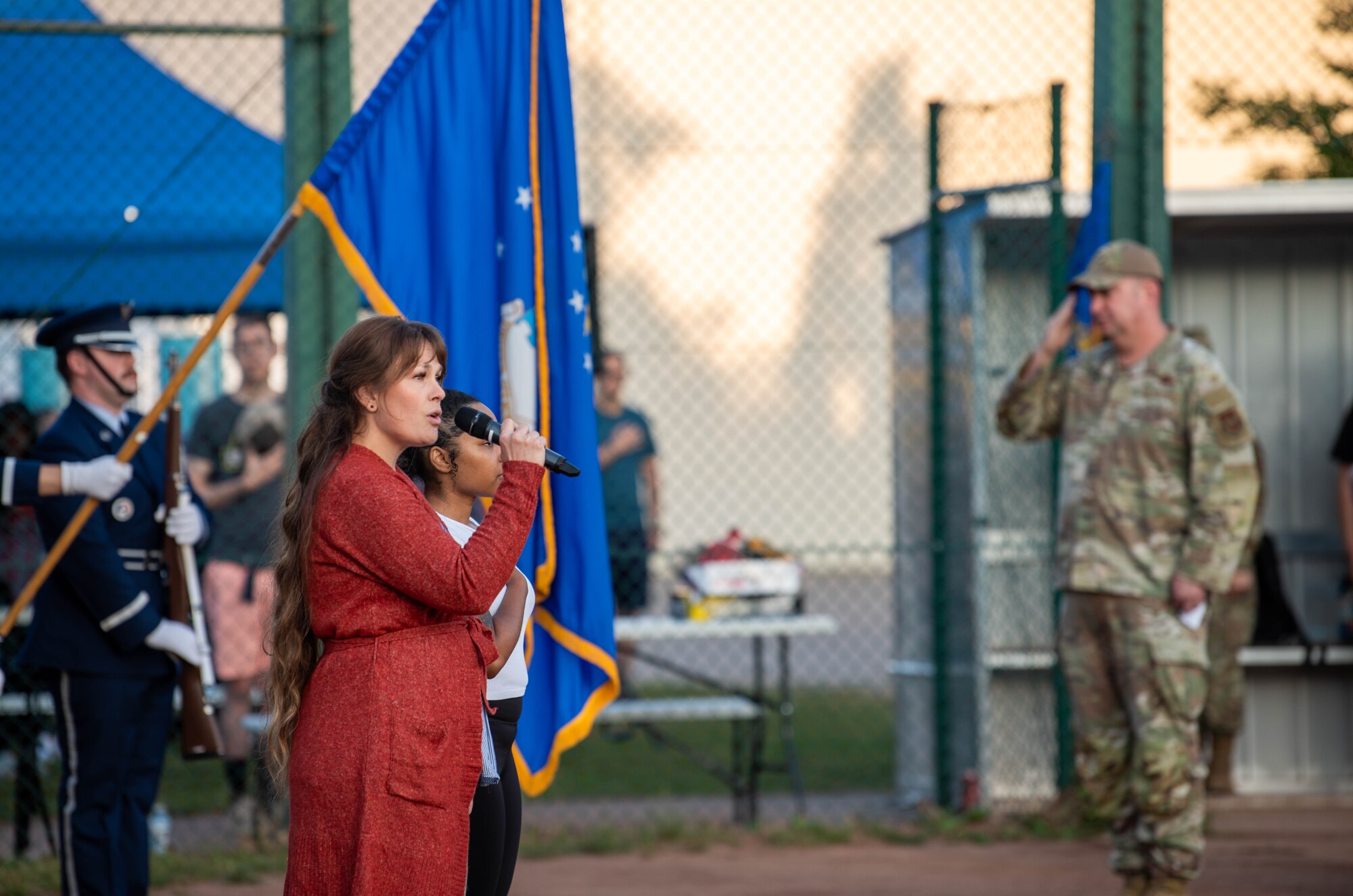 Someone singing the U.S. national anthem.