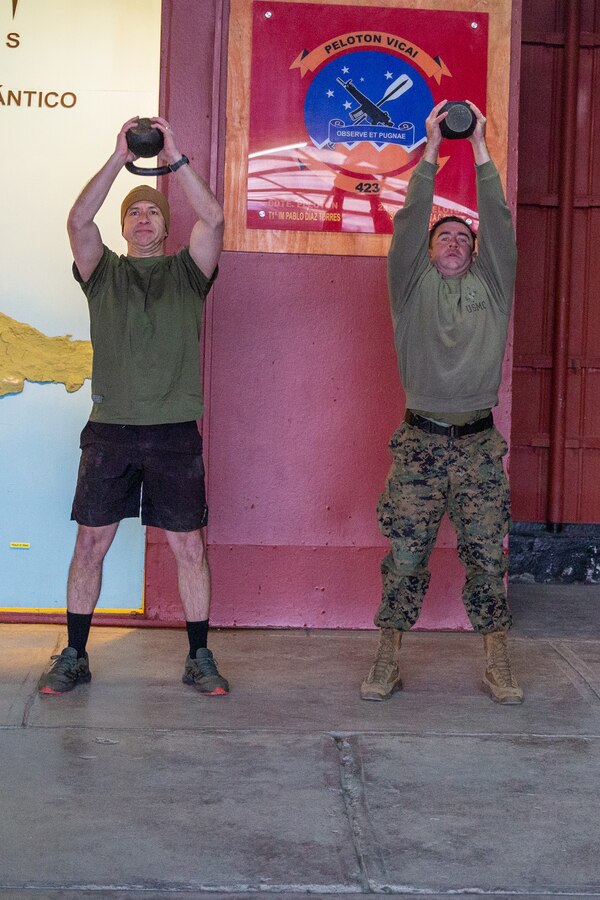 Armada de Chile, Cuerpo de Infantería de Marina Sargento Primero (Chilean Marine Corps, Gunnery Sergeant) Moises Avilez Avilez (left) and U.S. Marine Corps 1st Sgt. Bobby Fleming (right), Company C first sergeant with 1st Battalion, 24th Marine Regiment, 4th Marine Division, conducts kettlebell raises at Destacamento de Infanteria Marina Number 4 (Chilean Marine Detachment Number 4) “Cochrane”, Chile, during exercise UNITAS LXV, Sep. 3, 2024. The Marines conducted physical training to build camaraderie and esprit de corps, and maintain fitness standards.UNITAS focuses on strengthening our existing regional partnerships and encouraging the establishment of new relationships through the exchange of maritime mission-focused knowledge and expertise. (U.S. Marine Corps photo by Sgt. Gabriel Durand)