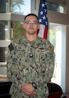 KINGS BAY, Ga. - Missile Technician 2nd Class David Espinoza, stationed aboard USS Florida (SSGN 728)(Blue), poses for a photo at the Trident Training Facility in Naval Submarine Base Kings Bay, Ga. Espinoza attended the revamped Attack Weapons System (AWS) full-day session led by a uniformed and civilian team which allows guided-missile submarine (SSGN) Sailors a refreshed opportunity to share lessons learned; discuss challenges; and interface directly with industry partners, technical experts, and other fleet Sailors in a more collaborative way. (U.S. Navy photo by Mass Communication Specialist 1st Class Travis S. Alston/Released)