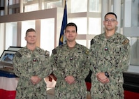 KINGS BAY, Ga. - (From left to right) Missile Technician 1st Class Aaron Akin, Fire Control Technician 2nd Class David Bagby stationed aboard USS Georgia (SSGN 729) (Blue), and Missile Technician 2nd Class David Espinoza, stationed aboard USS Florida (SSGN 728)(Blue), pose for a photo at the Trident Training Facility in Naval Submarine Base Kings Bay, Ga. The three Sailors attended the revamped Attack Weapons System (AWS) full-day session led by a uniformed and civilian team which allows guided-missile submarine (SSGN) Sailors a refreshed opportunity to share lessons learned; discuss challenges; and interface directly with industry partners, technical experts, and other fleet Sailors in a more collaborative way. (U.S. Navy photo by Mass Communication Specialist 1st Class Travis S. Alston/Released)