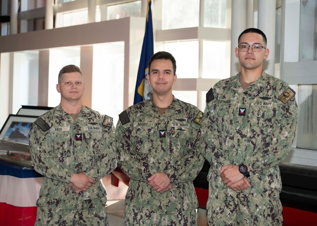 KINGS BAY, Ga. - (From left to right) Missile Technician 1st Class Aaron Akin, Fire Control Technician 2nd Class David Bagby stationed aboard USS Georgia (SSGN 729) (Blue), and Missile Technician 2nd Class David Espinoza, stationed aboard USS Florida (SSGN 728)(Blue), pose for a photo at the Trident Training Facility in Naval Submarine Base Kings Bay, Ga. The three Sailors attended the revamped Attack Weapons System (AWS) full-day session led by a uniformed and civilian team which allows guided-missile submarine (SSGN) Sailors a refreshed opportunity to share lessons learned; discuss challenges; and interface directly with industry partners, technical experts, and other fleet Sailors in a more collaborative way. (U.S. Navy photo by Mass Communication Specialist 1st Class Travis S. Alston/Released)