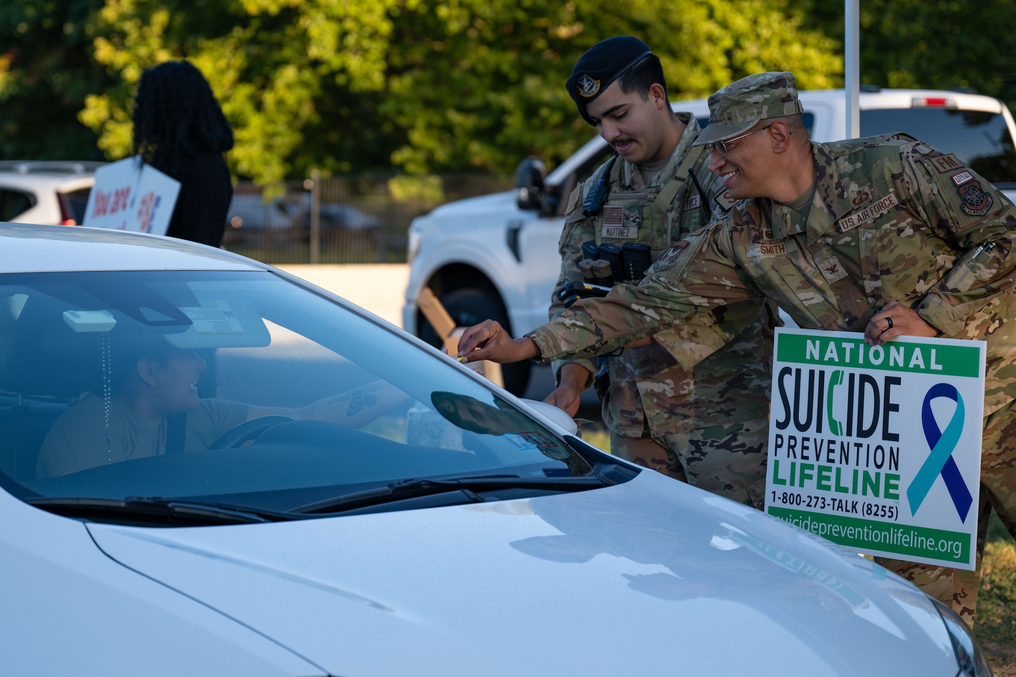 U.S. Air Force Col. Anthony Smith, Joint Base McGuire-Dix-Lakehurst commander and 87th Air Base Wing commander, passes out pins during a National Suicide Prevention Awareness Month event at JB MDL, N.J., Sept. 3, 2024. The month of September is the National Suicide Prevention Awareness Month where many organizations make a concerted effort to destigmatize the mental health struggles that many may face and take the opportunity to educate the public on recognizing signs someone is need of support as well as the avenues to receive support. (U.S. Air Force photo by Staff Sgt. Monica Roybal)