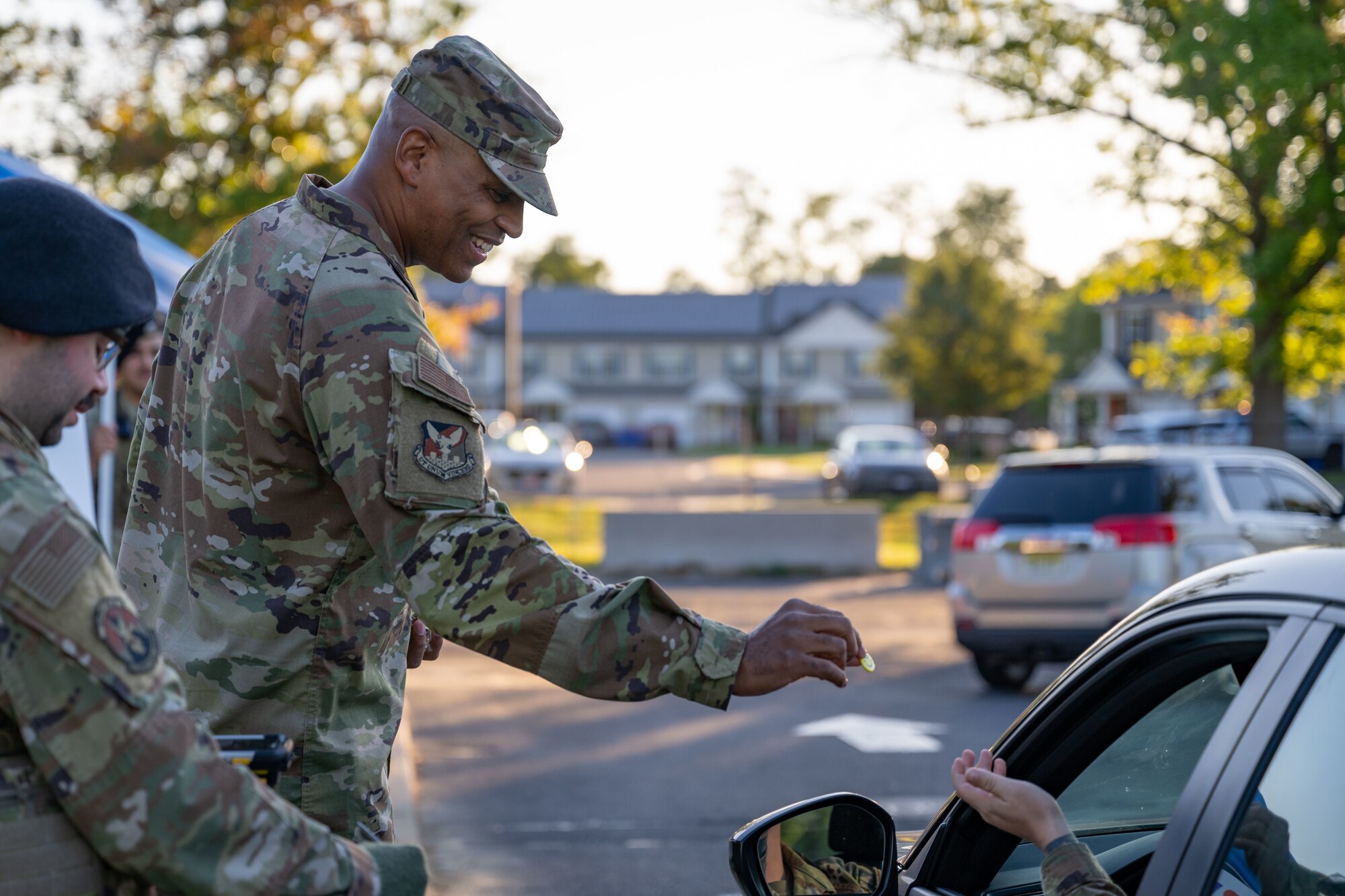 U.S. Air Force Chief Master Sgt. Michael Wynne, 87th Air Base Wing command chief, passes out pins during a National Suicide Prevention Awareness Month event at Joint Base McGuire-Dix-Lakehurst, N.J., Sept. 3, 2024. The month of September is the National Suicide Prevention Awareness Month where many organizations make a concerted effort to destigmatize the mental health struggles that many may face and take the opportunity to educate the public on recognizing signs someone is need of support as well as the avenues to receive support. (U.S. Air Force photo by Staff Sgt. Monica Roybal)