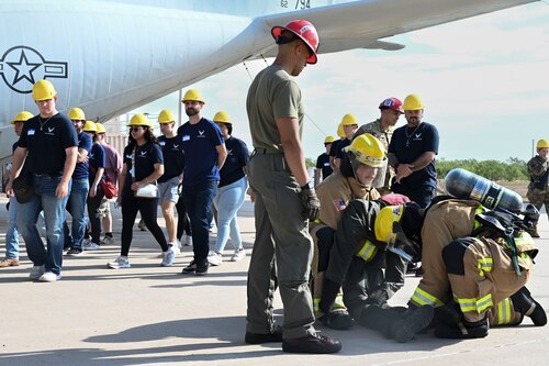 U.S. Air Force prospects watch Air Rescue and Firefighting training at the Louis F. Garland Department of Defense Fire Academy, Goodfellow Air Force Base, Aug. 28, 2024. ARFF training helps prepare Air Force firefighters to manage compromised aircraft in emergency situations. (U.S. Air Force photo by Airman 1st Class Madi Collier)