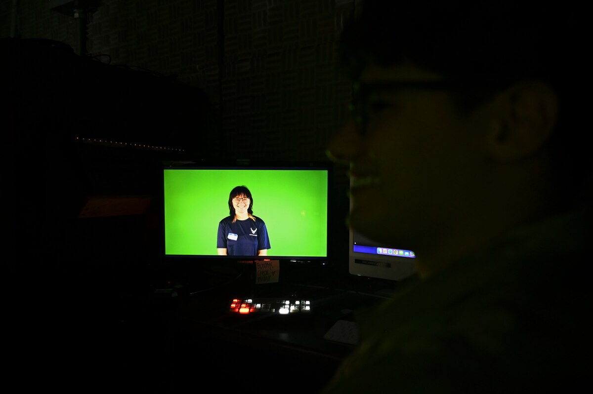 Alison Harvey, U.S. Air Force prospect, smiles during a mock on-camera interview while at the Public Affairs office during Career Day, Goodfellow Air Force Base, Aug. 28, 2024. During the mock interview, 17th Training Wing public affairs specialists demonstrated all of the components that are needed to record, capture audio and edit videos before release. (U.S. Air Force photo by Airman 1st Class Madi Collier)